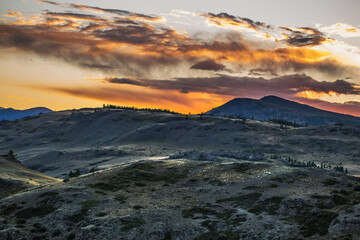 Mountain landscape at sunset. Kosh-Agachsky district of the Altai Republic, Russia