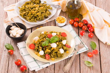 Fusilli pasta with cherry tomatoes and sweet corn.