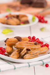 Mini churros with chocolate dipping sauce.