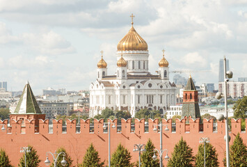 Fototapeta na wymiar Moscow, Russia. View to the Kremlin wall and and Christ the Saviour cathedral. Summer. Telephoto shot