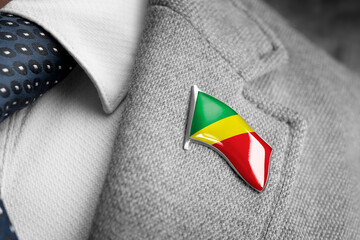 Metal badge with the flag of Congo on a suit lapel