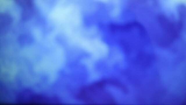 Abstract ang blurry dual color gradient background with liquid style waves featured violet and blue. Seamless looping video.