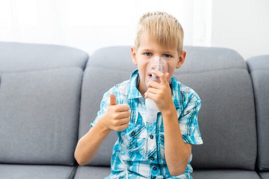 sick child breathes in a nebulizer