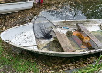 fishing boats on the lake shore, fishing as a hobby, fisherman's equipment, wild lake