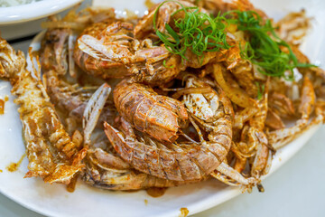 A dish of delicious fried mantis shrimp with salt and pepper