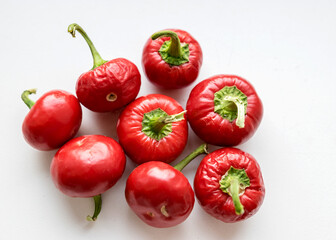 beautiful red mini peppers on a light background