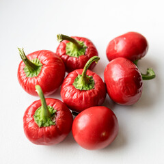 beautiful red mini peppers on a light background