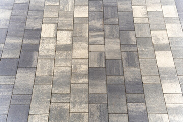 Background of street gray city paving slabs