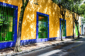 Peaceful view of a colorful building on the sidewalk in daylight