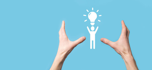 Businessman hold man icon with light bulbs, ideas of new ideas with innovative technology and creativity. concept creativity with bulbs that shine glitter.