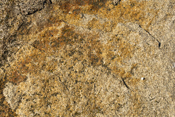 texture,large stone,boulder lying on the wharf,part of the breakwater