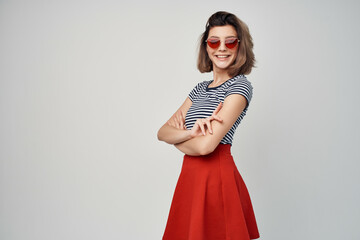 woman in striped t-shirt sunglasses Red skirt fashion