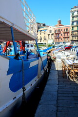 Fototapeta na wymiar touristic port of Palermo in Italy, sailboats moored in the harbor