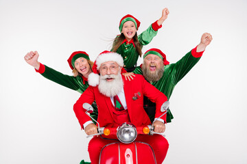 Portrait of attractive lucky cheerful friends riding motor bike having fun newyear day isolated...