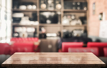 Empty wooden table top with lights bokeh on blur restaurant background.