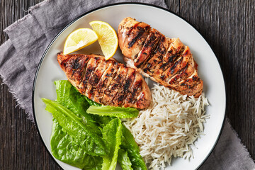 seared chicken breasts with lettuce and rice