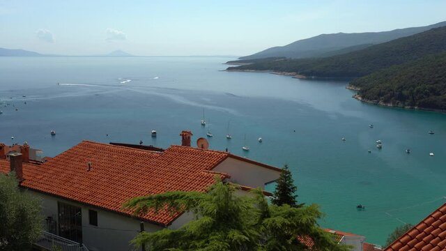 Arial view of the sea bay, on a summer sunny day, the movement of boats, Rabac, Istra, Croatia.