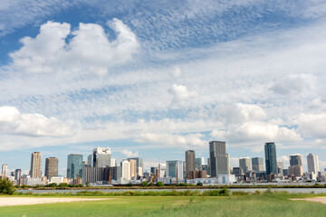 Fototapeta premium View of office buildings of central Osaka city from Yodogawa river bank