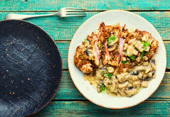 Turkey schnitzel with fried mushrooms