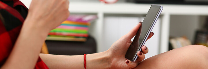 woman drinking coffe and look at laptop