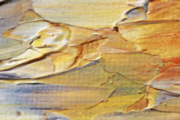 multicolored strokes of paint on the canvas 