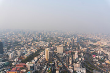 Fototapeta na wymiar Landscape of the top view Bangkok metropolis Thailand with the dirty clouds air pollution problem. full of tower and buildings in business area