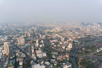Fototapeta na wymiar Landscape of the top view Bangkok metropolis Thailand with the dirty clouds air pollution problem and issue. the tower and building in business area