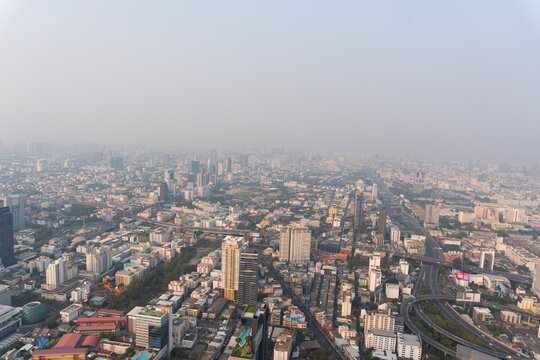 Landscape of the top view Bangkok metropolis Thailand with the dirty clouds air pollution problem. full of tower and buildings in business area © pploylp