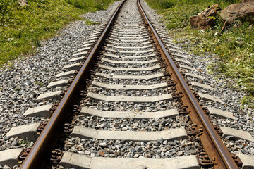 Fototapeta premium Railroad in the mountains. Railroad tracks and concrete sleepers.
