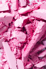 Cosmetic texture background. Broken eye shadows. Pink magenta decorative cosmetics 