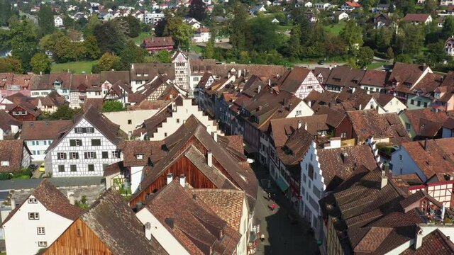 Aerial drone footage of the streets and the clock tower gate of the medieval Stein am Rhein town in Canton Schaffousen in eastern Switzerland