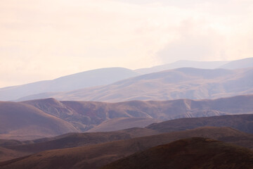 Fototapeta na wymiar Beautiful peaks of mountains standing in a row.