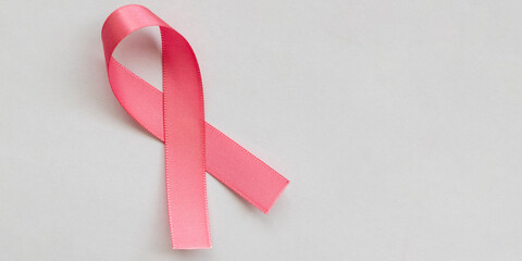 pink bow from the breast cancer prevention campaign. pink October. space for text - obrazy, fototapety, plakaty