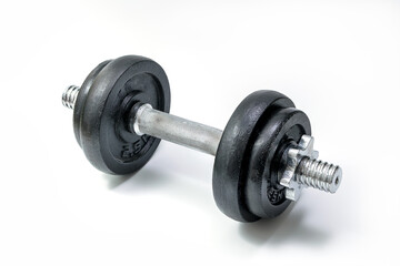 Fototapeta premium Black metal dumbbell isolated over white background with clipping path