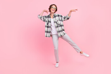 Full body photo of young attractive woman happy positive smile have fun dance isolated over pink color background