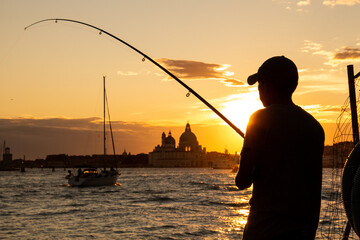Fototapeta premium Golden Hour Lagoon Fishing Venice Italy