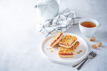 Sweet shortbread cookies with berry jam in a plate