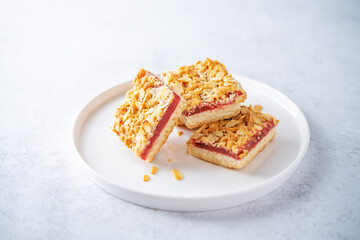 Sweet shortbread cookies with berry jam in a plate