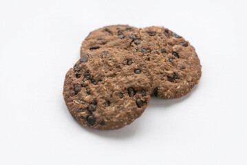 An oat biscuits with dark chocolate isolated on white background.