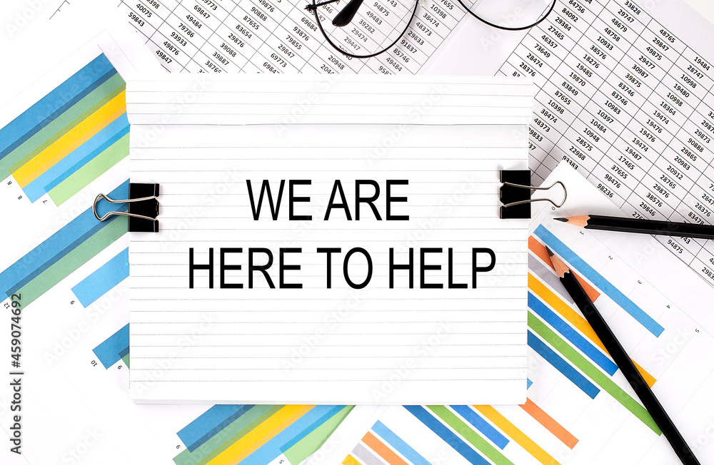 Poster notebook with pencils, glasses on graph background, with text we are here to help