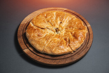 georgian khachapuri with mushrooms and potato or cheese pie on wooden board