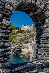 A window in the rock from which you can admire the Doria Castle and Lord Byron's cave in Portovenere, Italy