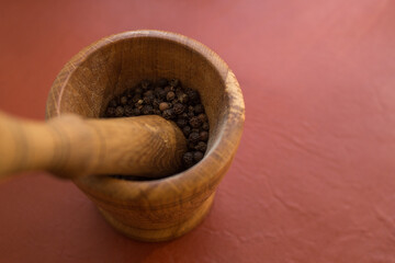 Black pepper in a mortar. Concept: spices, black pepper.