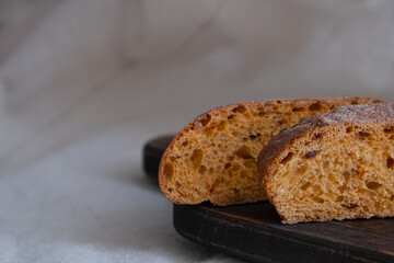 whole grain bread with sweet red paprika and tomatoes. Home-baked crispy bread cut into pieces.