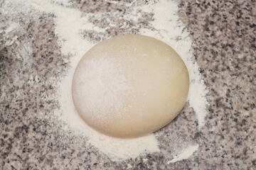 Fototapeta na wymiar Floured dough. For baking, pizza, biscuits, biscuits.