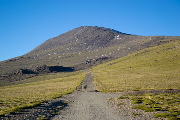 High mountain landscape called Alto del Chorrillo in Sierra Nevada with roads going up to Mulhacen