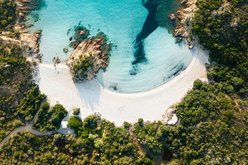 Fototapeta na wymiar View from above, stunning aerial view of a green coast with the beautiful Prince Beach (Spiaggia del Principe) a white sand beach bathed by a turquoise water. Sardinia, Italy.