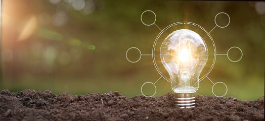 Green energy innovation light bulb with future industry of power generation icon graphic interface....