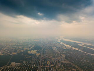 Obraz premium Sunset over Kiev. Cloudy evening. Aerial drone view.