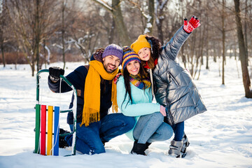 Full size photo of happy excited good mood family enjoying winter vacation father mother and daughter outside in park